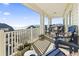 Relaxing balcony with ocean views and comfortable seating at 200 53Rd Ave. N # 501, North Myrtle Beach, SC 29582