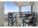 Ocean view balcony with table and chairs for outdoor dining at 200 53Rd Ave. N # 501, North Myrtle Beach, SC 29582