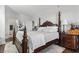 Bedroom with dark wood bed frame and nightstands at 200 53Rd Ave. N # 501, North Myrtle Beach, SC 29582