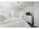 Main bedroom with white bedding, dresser, and view of bathroom at 200 53Rd Ave. N # 501, North Myrtle Beach, SC 29582