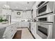 Kitchen with white cabinets, stainless steel appliances, and island at 200 53Rd Ave. N # 501, North Myrtle Beach, SC 29582