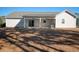 House back view with covered patio and fenced yard at 230 Kellys Cove Dr., Conway, SC 29526