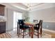 Bright dining area with table and four chairs, near sliding glass door at 230 Kellys Cove Dr., Conway, SC 29526