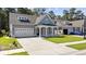 Gray two-story house with a large front yard and two-car garage at 2360 Goldfinch Dr., Myrtle Beach, SC 29577