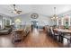 Elegant dining room features hardwood floors and a large table with seating for eight at 2409 Royal Oak Circle, North Myrtle Beach, SC 29582