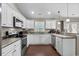 L-shaped kitchen with ample counter space and stainless steel appliances at 2579 Allen Dew Rd., Conway, SC 29527