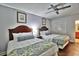 Guest bedroom with two twin beds, ceiling fan, and hardwood floors at 2600 N Ocean Blvd. # 1410, Myrtle Beach, SC 29577