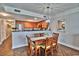 Wood dining table with six chairs, located adjacent to kitchen at 2600 N Ocean Blvd. # 1410, Myrtle Beach, SC 29577