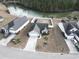 Aerial view of house near a canal with surrounding homes at 293 Foxpath Loop, Myrtle Beach, SC 29588