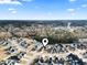 Aerial view showing the house's location in a residential neighborhood near a pond at 293 Foxpath Loop, Myrtle Beach, SC 29588