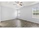 Bright bedroom with two windows and wood-look flooring at 293 Foxpath Loop, Myrtle Beach, SC 29588