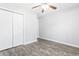 Simple bedroom with gray walls, wood-look floors, and double door closet at 293 Foxpath Loop, Myrtle Beach, SC 29588