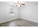 Bedroom with gray walls, wood-look floors, and a window with blinds at 293 Foxpath Loop, Myrtle Beach, SC 29588