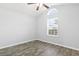 Bright bedroom with gray walls, wood-look floors, and an arched window at 293 Foxpath Loop, Myrtle Beach, SC 29588