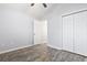 Spacious bedroom with gray walls, wood-look floors, and double door closet at 293 Foxpath Loop, Myrtle Beach, SC 29588