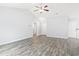 Spacious living area with light gray walls and wood-look floors at 293 Foxpath Loop, Myrtle Beach, SC 29588