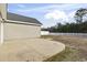 Large concrete patio extending from the back of the house at 293 Foxpath Loop, Myrtle Beach, SC 29588