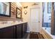 Double vanity bathroom with dark brown cabinets and a soaking tub at 2998 Skylar Dr., Myrtle Beach, SC 29577