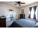 Cozy bedroom with double bed, ceiling fan, and ample closet space at 2998 Skylar Dr., Myrtle Beach, SC 29577