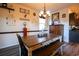 Bright dining room features a rustic farmhouse table with bench seating at 2998 Skylar Dr., Myrtle Beach, SC 29577