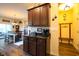 Kitchen features granite countertop and dark brown cabinets at 2998 Skylar Dr., Myrtle Beach, SC 29577