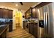 Stainless steel appliances and dark brown cabinetry in kitchen at 2998 Skylar Dr., Myrtle Beach, SC 29577