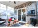 Cozy sunroom with seating, a fireplace, and sliding glass doors at 2998 Skylar Dr., Myrtle Beach, SC 29577