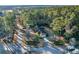 Aerial view showing a brick home with a large yard and trees at 300 Mcarthur St., Tabor City, NC 28463