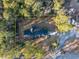 Overhead view of single-Gathering home with driveway and surrounding trees at 300 Mcarthur St., Tabor City, NC 28463