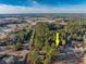 Aerial view of house nestled in a wooded area, showcasing its location and surrounding landscape at 300 Mcarthur St., Tabor City, NC 28463