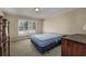 Simple bedroom with a double bed and plenty of natural light at 300 Mcarthur St., Tabor City, NC 28463