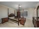 Spacious bedroom with a large window and wooden furniture at 300 Mcarthur St., Tabor City, NC 28463