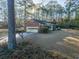 Back of brick house with garage and large yard at 300 Mcarthur St., Tabor City, NC 28463