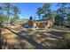 Rear view of brick house with large yard at 300 Mcarthur St., Tabor City, NC 28463