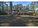 Brick ranch house with large yard and mature trees at 300 Mcarthur St., Tabor City, NC 28463