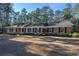 Ranch style brick home with landscaped yard at 300 Mcarthur St., Tabor City, NC 28463