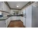 Galley kitchen with white cabinets and green countertops at 300 Mcarthur St., Tabor City, NC 28463