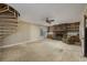 Spacious living room with brick fireplace and spiral staircase at 300 Mcarthur St., Tabor City, NC 28463