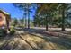 Landscaped yard with mature trees and open space at 300 Mcarthur St., Tabor City, NC 28463