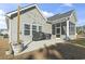 Spacious backyard patio with grill and screened porch at 308 Turning Pines Loop, Myrtle Beach, SC 29579