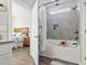 Bathroom with soaking tub, shower, and grey tile surround at 308 Turning Pines Loop, Myrtle Beach, SC 29579