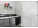 Laundry room with LG washer and dryer, and overhead shelving at 308 Turning Pines Loop, Myrtle Beach, SC 29579