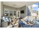 Relaxing screened porch with seating area and ceiling fan at 308 Turning Pines Loop, Myrtle Beach, SC 29579