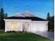 One-story home with white siding, a two-car garage, and a neatly landscaped lawn at 3091 Dover Branch Dr., Little River, SC 29566