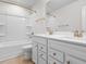 Double vanity bathroom with white cabinets and gold fixtures at 3304 Candytuft Dr., Conway, SC 29526