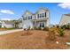 Two-story house with gray siding, a white garage door, and landscaping at 3304 Candytuft Dr., Conway, SC 29526