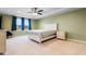 Main bedroom with window, ceiling fan, and en-suite bathroom at 3304 Candytuft Dr., Conway, SC 29526