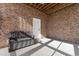 Unfinished basement with brick walls and a bench at 3714 Old Pointe Circle, North Myrtle Beach, SC 29582