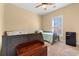 Small bedroom with twin beds, window, and mini-fridge at 3714 Old Pointe Circle, North Myrtle Beach, SC 29582