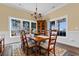 Bright dining room with hardwood floors and large windows at 3714 Old Pointe Circle, North Myrtle Beach, SC 29582